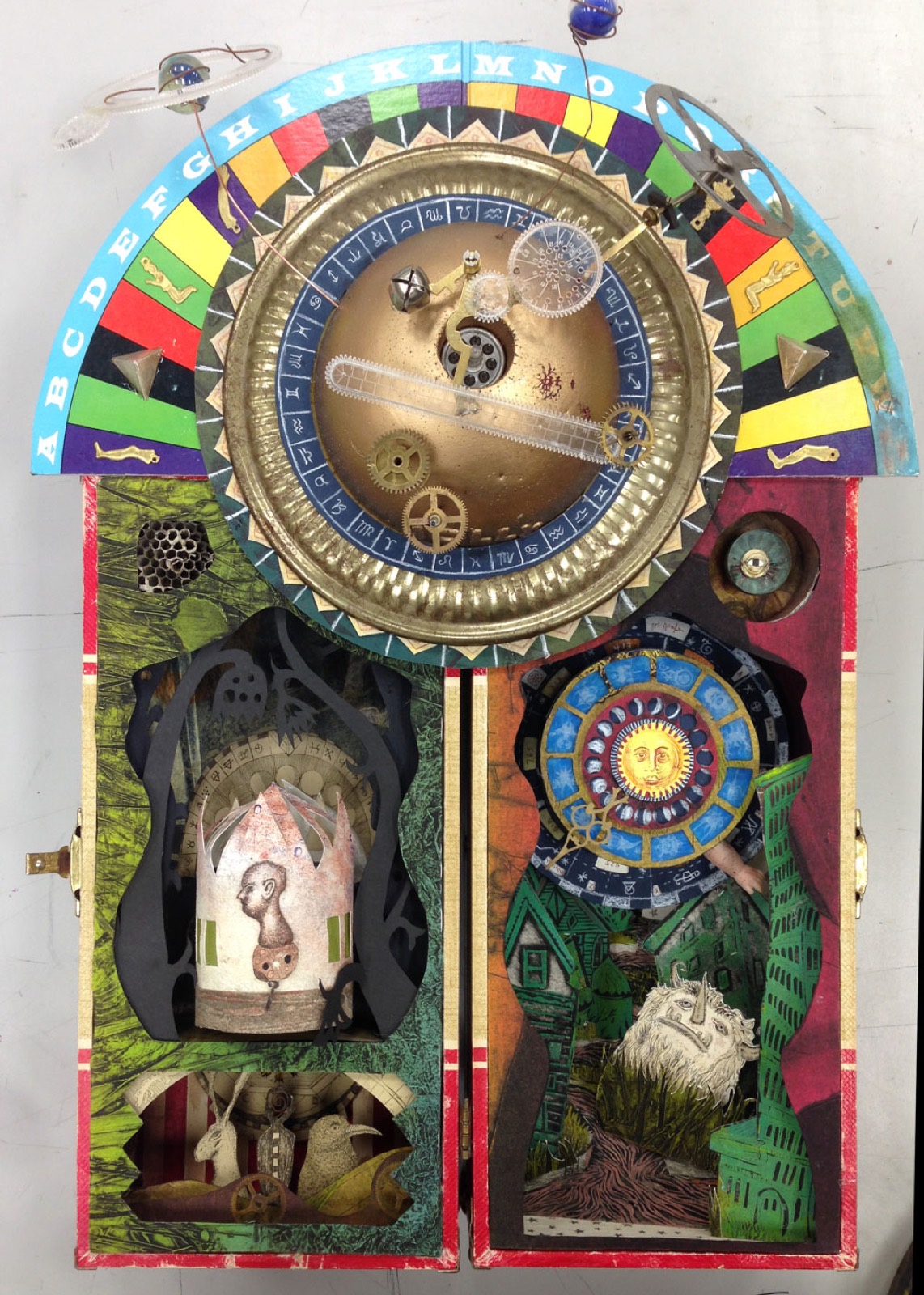 Portage Year: An Almanach — the closed assemblage in a found doll’s case, with gilt dome, orrery, and two chambers.